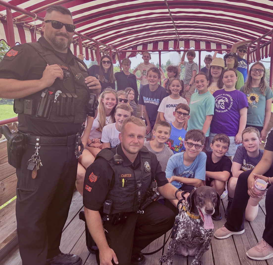 Kingston police and Summer Camp students with Dilly the Dog